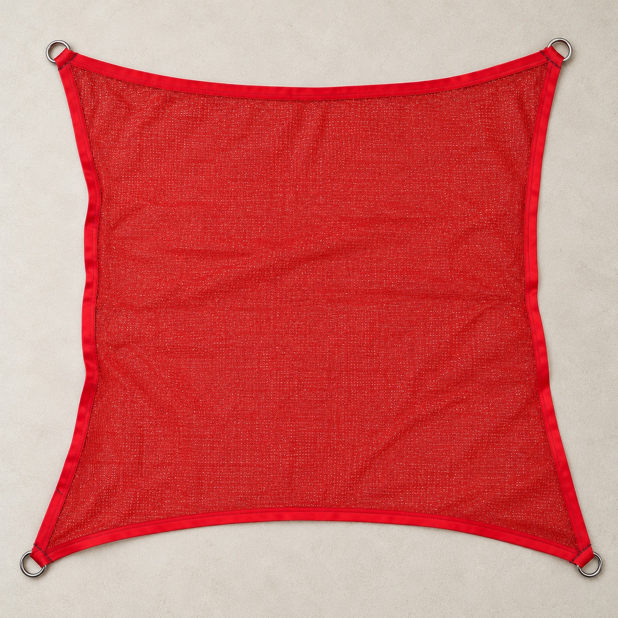 Square shade sail, red, laid flat with stainless D-rings